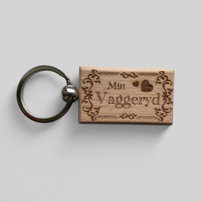 Nyckelring, rektangulär, 32 x 52mm, bok - med gravyr